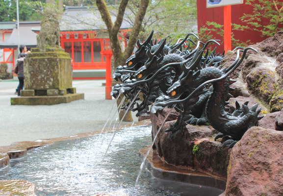 Fountain for cleansing decorated with dragons.