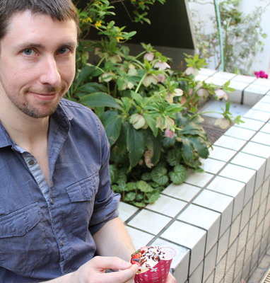 Adam eating his crepe.