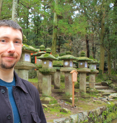 Adam in front of lanterns on the way up.