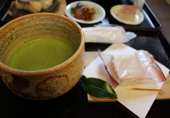 Green tea with a small dessert.