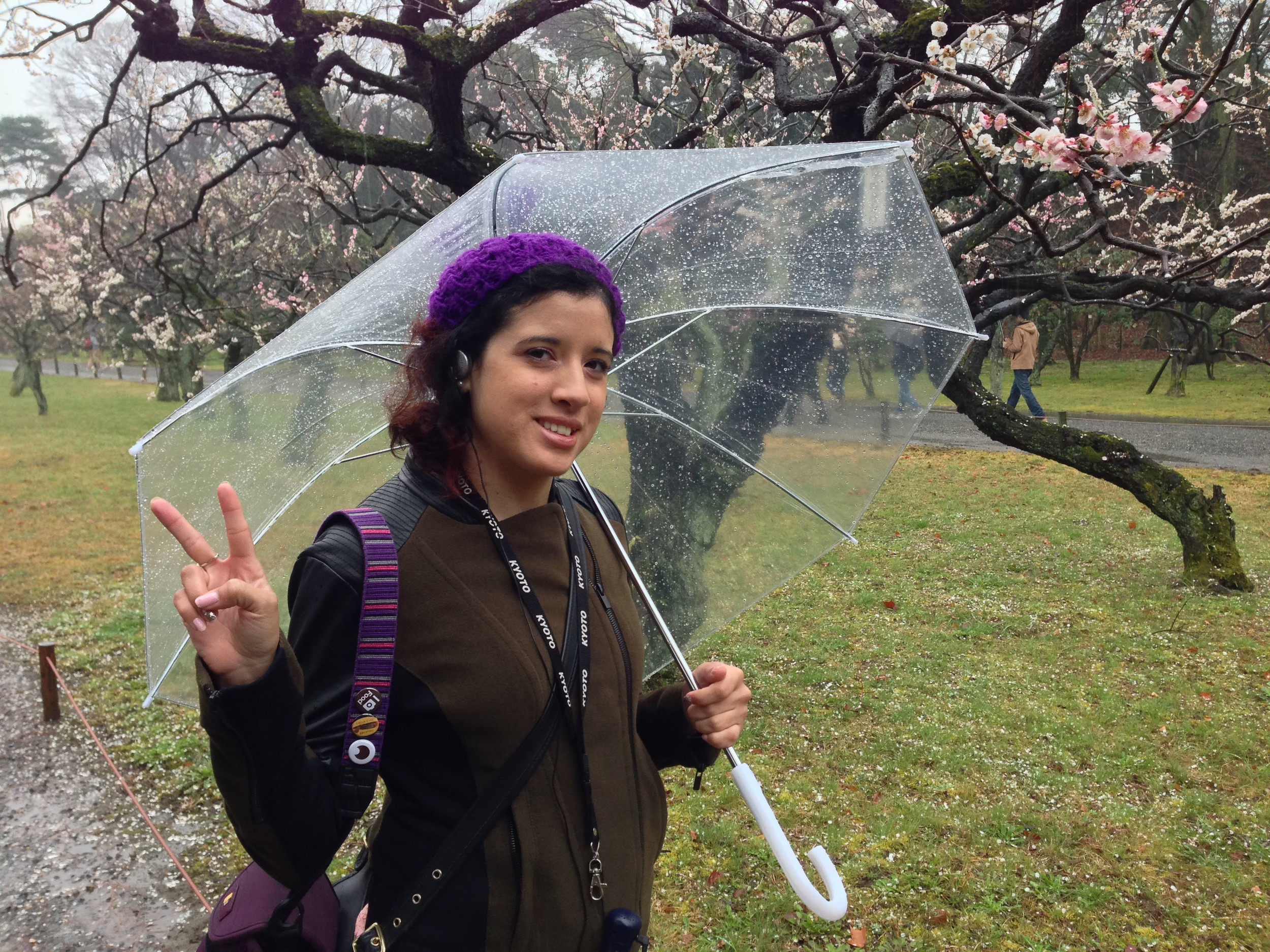 Marilyn in the rain under the blossoms.