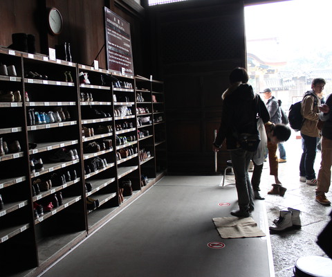 Taking off our shoes for the palace tour.