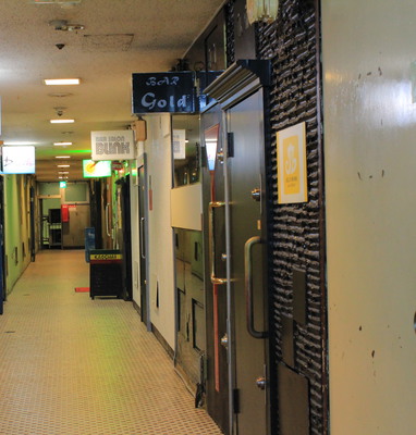 A look down the hallway of an apartment building bar.