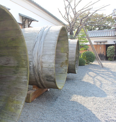 Old wooden barrels for brewing sake. Imagine trying to get the rice out of those cracks in the boards.